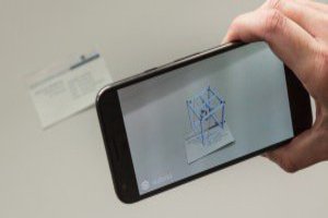 Ein 3D Businesskarte auf dem Smartphone, wenn man die Kamera auf eine Papier Businesskarte richtet